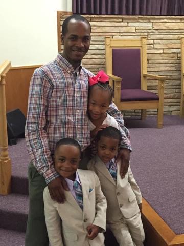 Anthony and 3 of his kids at church